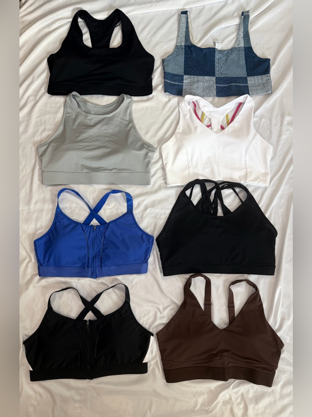 Fabletics Mixed-Pack Sports Bras in Black, Blue, White, Gray, Brown